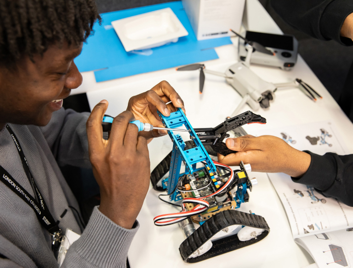 Students assembling robot