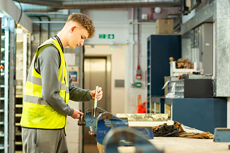 Student working in construction workshop