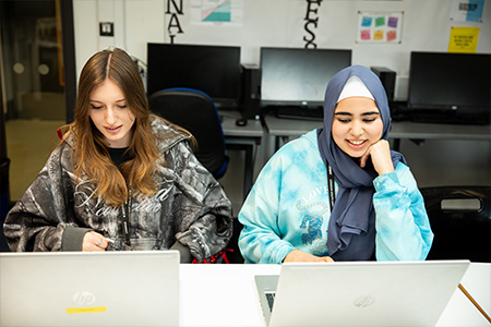 2 students at a desk